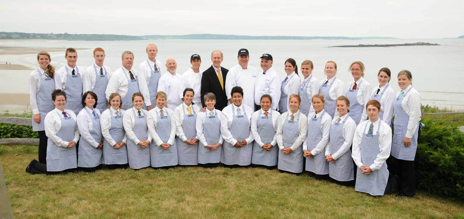 Our team of professional planners, chefs, bartenders, and servers, at beachfront wedding in Cape Elizabeth, Maine.